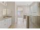 Bright bathroom featuring dual vanity, step-in shower with a tub, and a view to bedroom at 25424 S 224Th Pl, Queen Creek, AZ 85142
