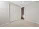 Neutral bedroom with plush carpet and closet with paneled sliding doors at 25424 S 224Th Pl, Queen Creek, AZ 85142