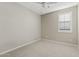 Bedroom with carpet flooring, neutral walls, and plantation shutters at 25424 S 224Th Pl, Queen Creek, AZ 85142