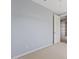 Bedroom with carpet flooring, light blue walls, and a view to bathroom at 25424 S 224Th Pl, Queen Creek, AZ 85142