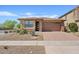 Charming single-story home with desert landscaping, brick accents, and a two-car garage on a sunny day at 25424 S 224Th Pl, Queen Creek, AZ 85142