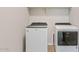Convenient laundry room with modern, front-loading washer and dryer at 25424 S 224Th Pl, Queen Creek, AZ 85142