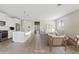 Bright, open-concept living space with a kitchen island, modern appliances, and a comfortable seating area at 25424 S 224Th Pl, Queen Creek, AZ 85142