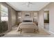 Cozy main bedroom with a king-size bed, neutral tones, and access to an en-suite bathroom at 25424 S 224Th Pl, Queen Creek, AZ 85142