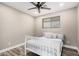 Cozy bedroom featuring neutral paint, new flooring, and a window with natural light at 3315 W Shaw Butte Dr, Phoenix, AZ 85029