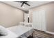 Cozy bedroom with ceiling fan, closet and wood-look laminate flooring at 3315 W Shaw Butte Dr, Phoenix, AZ 85029