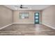 Bright and airy living room featuring wood floors, a contemporary door, and neutral walls at 3315 W Shaw Butte Dr, Phoenix, AZ 85029