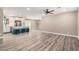 Open-concept living space with wood flooring, neutral paint, and a stylish kitchen island at 3315 W Shaw Butte Dr, Phoenix, AZ 85029