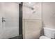 Shower featuring stylish tile work with geometric patterns, a rainfall showerhead, and modern hardware at 3315 W Shaw Butte Dr, Phoenix, AZ 85029