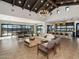 Open clubhouse lounge area with stylish seating, modern lighting, and access to kitchen and outdoor spaces at 3513 E Audrey Dr, San Tan Valley, AZ 85143