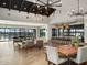 Spacious clubhouse lounge featuring modern seating, high ceilings, and a chic kitchen and dining area at 3513 E Audrey Dr, San Tan Valley, AZ 85143