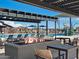 Outdoor fire pit with comfortable seating and views of the community pool, perfect for relaxing evenings at 3513 E Audrey Dr, San Tan Valley, AZ 85143