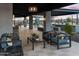 Inviting outdoor patio area with comfortable seating and modern lighting for relaxation and entertainment at 3513 E Audrey Dr, San Tan Valley, AZ 85143