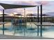 Community splash pad with colorful play structures and shade, perfect for Gathering fun at 3513 E Audrey Dr, San Tan Valley, AZ 85143