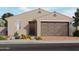 Single-story home featuring neutral stucco, a two-car garage, and desert landscaping at 35493 N Seedling St, San Tan Valley, AZ 85144