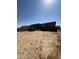 Large backyard with desert landscape and plenty of room for outdoor activities at 36992 W Capri Ave, Maricopa, AZ 85138
