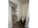 Bathroom featuring a toilet and walk-in closet with carpet flooring and shelving at 36992 W Capri Ave, Maricopa, AZ 85138