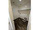 Practical laundry room featuring sleek floors, a convenient shelf, and washer hookups at 36992 W Capri Ave, Maricopa, AZ 85138