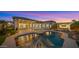 Beautiful backyard showcasing a sparkling pool, covered patio, and manicured landscaping, perfect for outdoor living at 3953 E Lafayette Ave, Gilbert, AZ 85298