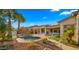 Lush backyard with pool, spa, water feature, landscaping, and patio with outdoor seating and dining for entertaining at 3953 E Lafayette Ave, Gilbert, AZ 85298