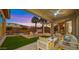 Outdoor living space featuring a patio, pool, outdoor seating, and a lush backyard at 3953 E Lafayette Ave, Gilbert, AZ 85298
