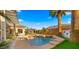Gorgeous backyard oasis featuring a sparkling pool, built in grill, a water feature, and covered patio perfect for relaxation at 3953 E Lafayette Ave, Gilbert, AZ 85298
