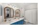 Bright bathroom featuring double sinks, white counters and blue cabinets at 3953 E Lafayette Ave, Gilbert, AZ 85298