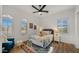 Cozy bedroom with natural light, an area rug and a sitting chair at 3953 E Lafayette Ave, Gilbert, AZ 85298