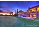 Elegant clubhouse exterior with arched walkways and lush landscaping overlooking the golf course at 3953 E Lafayette Ave, Gilbert, AZ 85298