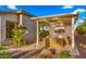 Relaxing covered patio with outdoor seating, overlooking the landscaped backyard with a pool and covered patio at 3953 E Lafayette Ave, Gilbert, AZ 85298