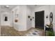 Stylish foyer featuring a dark front door and decorative alcoves and decor at 3953 E Lafayette Ave, Gilbert, AZ 85298