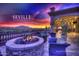 Inviting outdoor patio with stone fire pit and comfortable seating at Seville Golf and Country Club at 3953 E Lafayette Ave, Gilbert, AZ 85298