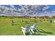 Scenic golf course with chairs and mountain views, perfect for a relaxing day on the green at 3953 E Lafayette Ave, Gilbert, AZ 85298