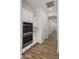 Hallway with a double oven and white cabinetry at 3953 E Lafayette Ave, Gilbert, AZ 85298