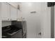 Well-equipped laundry room with a modern washer and dryer, and ample storage space at 3953 E Lafayette Ave, Gilbert, AZ 85298