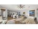 Open-concept living space with a kitchen, an adjacent living room with natural light, and neutral decor at 3953 E Lafayette Ave, Gilbert, AZ 85298