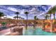 Resort-style swimming pool with fountains, lounge chairs, and palm trees for a relaxing atmosphere at 3953 E Lafayette Ave, Gilbert, AZ 85298