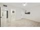Bedroom with a ceiling fan, tile floors, fresh white paint and an attached bathroom at 4410 N 20Th Ave, Phoenix, AZ 85015
