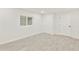 Minimalist bedroom with tile floors, closet and exterior window at 4410 N 20Th Ave, Phoenix, AZ 85015
