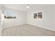 Bright bedroom featuring tile floors, white walls, and natural light at 4410 N 20Th Ave, Phoenix, AZ 85015