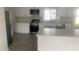 Spacious kitchen with white cabinets, stainless steel appliances, and ample counter space at 4410 N 20Th Ave, Phoenix, AZ 85015