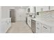 Modern kitchen with stainless steel appliances, white cabinets, and sleek hardware at 4410 N 20Th Ave, Phoenix, AZ 85015