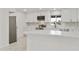 Modern kitchen featuring white cabinets, stainless steel appliances, and a breakfast bar at 4410 N 20Th Ave, Phoenix, AZ 85015
