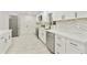 Modern kitchen with stainless steel appliances, white cabinets, and sleek hardware at 4410 N 20Th Ave, Phoenix, AZ 85015