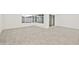 Bright living room with wood-look tile flooring, white walls, and sliding glass doors at 4410 N 20Th Ave, Phoenix, AZ 85015
