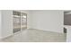 Open living area with tile flooring, a sliding door, and view to the patio at 4410 N 20Th Ave, Phoenix, AZ 85015