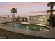 Backyard pool with new patio and updated home exterior featuring palm trees at 4410 N 20Th Ave, Phoenix, AZ 85015