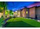 Expansive backyard with manicured lawn, a pool, spa, and covered patio, perfect for outdoor living at 4431 E Gemini Pl, Chandler, AZ 85249