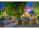 Outdoor kitchen with built-in grill and bar area, ideal for entertaining and enjoying the backyard at 4431 E Gemini Pl, Chandler, AZ 85249