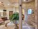 Beautiful bathroom with a standalone tub, walk-in shower, and stylish stone tiling at 4431 E Gemini Pl, Chandler, AZ 85249